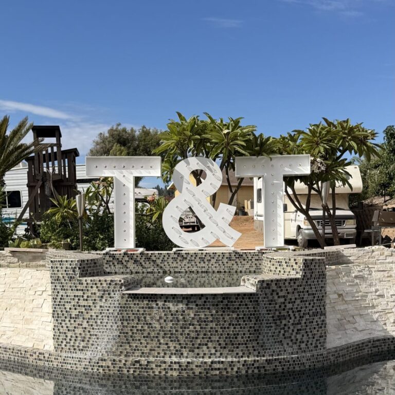 T&T initial marquee letters for an engagement celebration